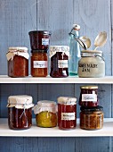 Various types of jam and jellies on a shelf