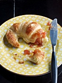 Close-up of croissant with quince jam on plate