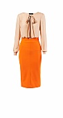 Peach blouse and orange pencil skirt for office wear against white background