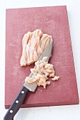 Beef being chopped finely on chopping board