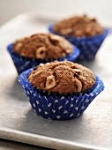 Hazelnut muffins in blue paper cups