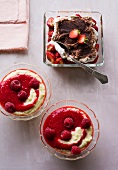 Strawberry tiramisu in serving dish and raspberry semolina in bowls