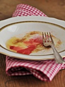 Empty plate after eating with fork