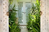 Entrance of bungalow with white door in Veliganduhuraa, Maldives
