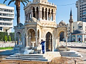 People at Konak Square in front of Izmir Clock Tower in Aegean Region, Turkey