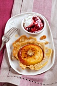 Pancakes with cranberry cream on plate