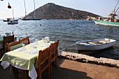 Laid out tables on port in Gumusluk, Bodrum, Aegean Region, Turkey