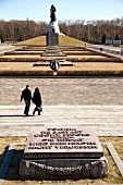 Couple in front of Soviet War Memorial Treptow in Berlin