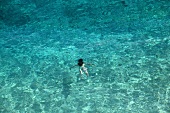 Tourist swimming in Kaputas beach, Aegean, Turkey, aerial view