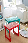 Blue and red side tables with text on table