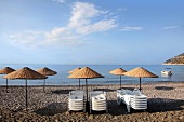 Beach umbrellas on beach in Ovabuku, Mesudiye in Ordu Province, Turkey