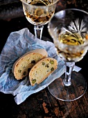 Pistachio biscuits and white wine in glasses