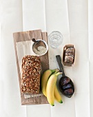 Sunflower bread, quinoa, figs, dates and bananas, symbolizing magnesium rich food