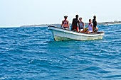 Tourists sailing on boat in sea, Zanzibar Island, Tanzania, East Africa