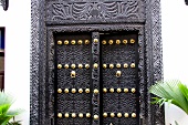Black door with carvings in Zanzibar, Tanzania, East Africa