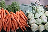 Fresh carrots and kohlrabi in market