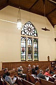 People praying at Zion Evangelical Lutheran Church, Nova Scotia, Canada