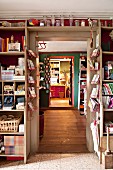 Shelves built around a doorframe with a view into the next room