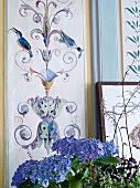Wall of dining room with ornamental motifs of plants and birds at Castle Dennenlohe