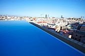 View of cityscape with Infinity Pool and Grand Hotel Central in Barcelona, Spain