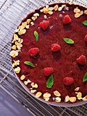Close-up of After Eight tart garnished with raspberries and mint on plate