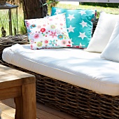 Wooden sofa in white and cushion with stars motif