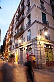 People walking in allay at calle del notariado in evening, Barcelona, Spain
