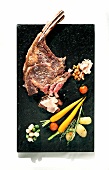 Tomahawk steak with vegetables on plate