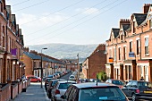 View of houses and vehicles on street at Belfast, Northern Ireland