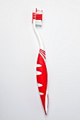 Zahnbürste in rot und weiß, von Ajona
