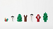 Colourful wooden figures on white background