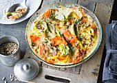 Carrot and blue cheese gratin with leek and sunflower seeds