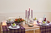 Table decorated with candles and tableware