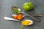 Grated lime and other vegetables on spoons