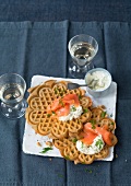 Buckwheat waffles with smoked salmon on plate