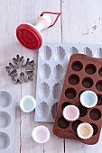 A biscuit cutter, silicon baking moulds and paper cases