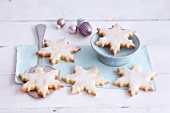 Snowflake-shaped biscuits with pineapple glaze