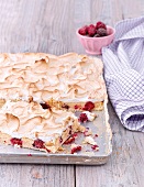 Blackberry tray bake cake topped with meringue
