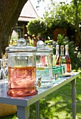 Drinks for a garden party in bottle and glass jars