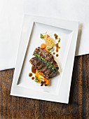 Grilled Wagyu beef shoulder with carrots and onions