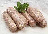 Raw pork sausages with apple pieces