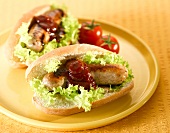 A sausage sandwich with barbecue sauce