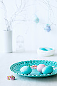 Easter eggs on a turquoise plate