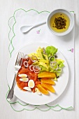 Salmon salad with egg, celery and oranges