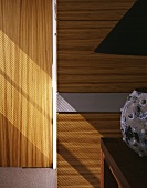 Wood paneling on a well next to a door