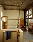 Open, improvised shower in the sleeping quarters of an industrial hall