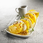 Mango mozzarella carpaccio with walnuts and chilli