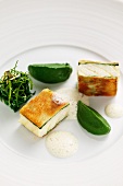 Sturgeon wrapped in white bread with spinach