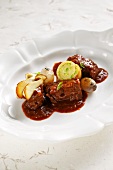 Chamois goulash with leek roulade and mushrooms