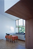 View of an open kitchen with an rustic dining area